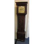 A George III oak longcase clock with eight day movement striking on a bell, the square brass dial