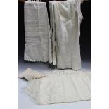 A small group of various textiles, including a silk embroidered cloth, a nightgown and other