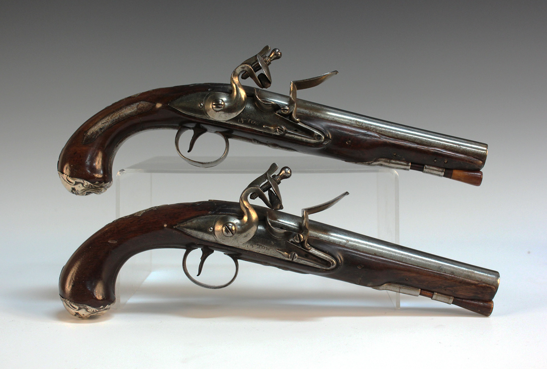 A pair of late 18th Century 20 bore flintlock holster pistols by Griffin & Tow, barrel length approx