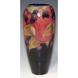 A Moorcroft pottery vase, circa 1916, of slender elongated ovoid form, decorated with Pomegranate