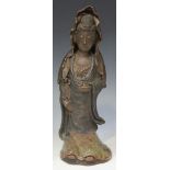 A Chinese stoneware figure of Guanyin, 20th Century, modelled standing wearing an iron oxide