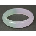 A Chinese lavender and pale green jade bangle, modern, diameter approx 7.8cm.