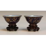 A pair of Chinese Canton mazarine blue enamel tea bowls, probably 19th Century, each exterior finely