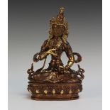 A Sino-Tibetan patinated and parcel gilt bronze figure of Tara, probably early 20th Century,