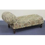 A late Victorian chaise-longue, upholstered in floral fabric on turned legs, length approx 172cm.