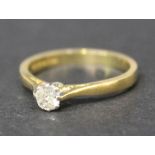 An 18ct gold and diamond set single stone ring, claw set with a cushion shaped diamond, ring size
