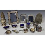 A small collection of silver and plated items, including a silver sugar caster, Birmingham 1940 by