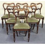 A set of six mid-Victorian mahogany bar and spoon back dining chairs, the upholstered drop-in