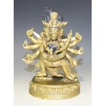 A Sino-Tibetan gilt bronze figure group of Mahakala and his consort in Yab-Yum, 20th Century, the