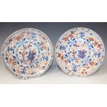 A pair of Chinese Imari export porcelain saucer dishes, Kangxi period, each painted and gilt with