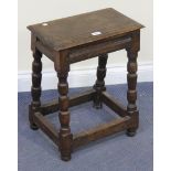 A late 19th Century oak joint stool, the moulded rectangular seat above a moulded frieze, on