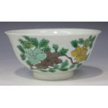 A Chinese famille verte porcelain bowl, mark of Kangxi but modern, the sides incised and painted