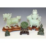 A Chinese pale celadon jade carving of a Buddhistic lion, late 20th Century, modelled standing