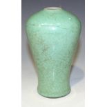 A Chinese apple green glazed porcelain meiping, Kangxi period, the baluster body covered in a