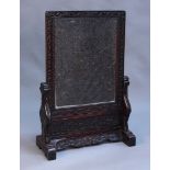 A Chinese hardwood floor screen, late 19th Century, the removable rectangular panel inset with a