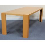 A large modern beech dining table, raised on block supports, length approx 250cm.