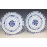 A pair of Chinese blue and white export porcelain saucer dishes, mark of Kangxi but late 19th