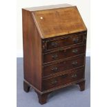 A 20th Century reproduction mahogany bureau, the fall front above four drawers, on bracket feet,