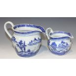 A pair of graduated Chinese Canton blue and white export porcelain jugs, 19th Century, each