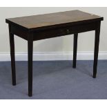 A George III mahogany rectangular fold-over tea table, fitted with a single frieze drawer, on fluted