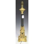 A 20th Century Regency style black patinated and gilt cast metal table lamp, the reeded stem with