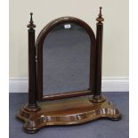 A Victorian mahogany swing frame toilet mirror, on bun feet, height approx 74cm.