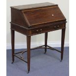 An Edwardian mahogany bureau with crossbanded and line inlaid decoration, the fall front revealing a