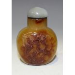 A Chinese agate snuff bottle, probably 20th Century, of flattened circular form, each side carved in