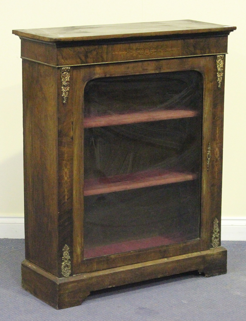 A Victorian burr walnut pier cabinet with inlaid decoration and gilt metal mounts, fitted with a