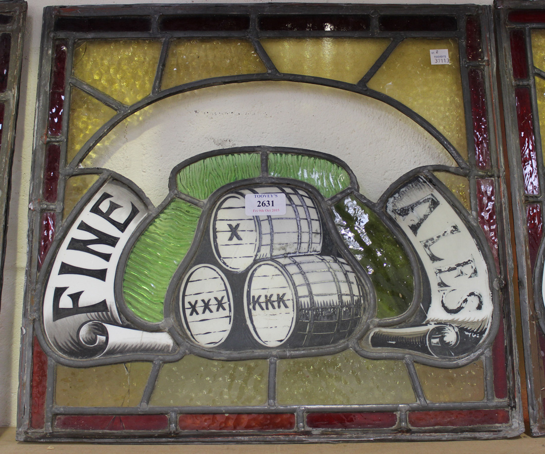 A set of six stained and leaded glass panels, two decorated with a stack of three barrels and