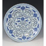 A Chinese blue and white circular dish, mark of Kangxi but late 19th Century, painted with a