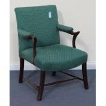 An early 20th Century George III style mahogany showframe armchair upholstered in green fabric,