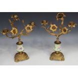 A pair of late 19th/early 20th Century gilt cast metal and porcelain mounted three light candelabra,