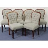 A set of six Victorian mahogany framed dining chairs upholstered in taupe fabric, on turned legs.