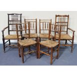 A harlequin set of six 19th Century spindle back rush seat dining chairs, comprising two carvers and