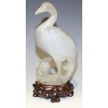 A Chinese carved agate figure of a crane, 20th Century, the stone of greyish tone, height approx