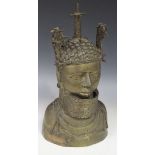A 20th Century cast bronze Benin style head and shoulders portrait bust of a tribal figure wearing a