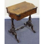 A Victorian burr walnut writing table, the hinged top and frieze drawer raised on turned twin