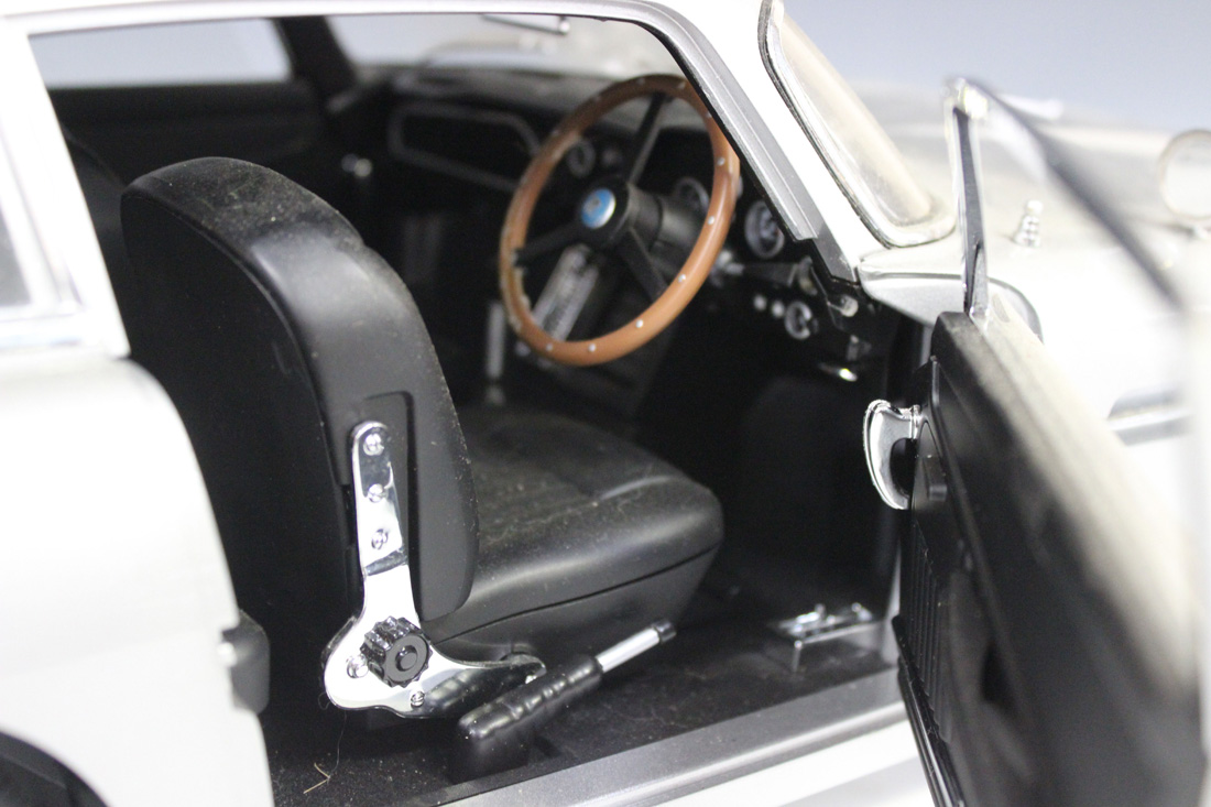 A 1:8 scale replica model of James Bond's Aston Martin DB5, together with related magazine issues. - Image 4 of 5