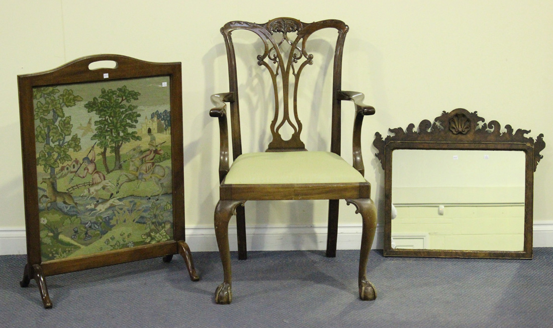 A late 20th Century George III style mahogany elbow chair, the carved and pierced splat back above a