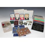 A collection of British and foreign coins, including thirteen year-type specimen proof sets from