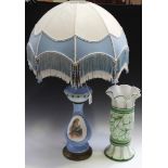 An early 20th Century opaline glass table oil lamp, converted to electricity, the baluster body