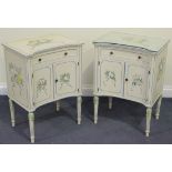 A pair of 20th Century white and floral painted bedside cabinets, both fitted with a drawer above