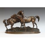 Pierre-Jules Mêne - 'L'Accolade', a 19th Century French brown/green patinated cast bronze equestrian