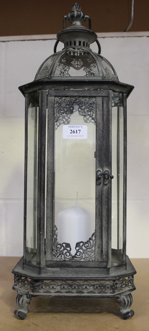 A modern Eastern style verdigris metal canted rectangular hanging lantern, height approx 54cm.