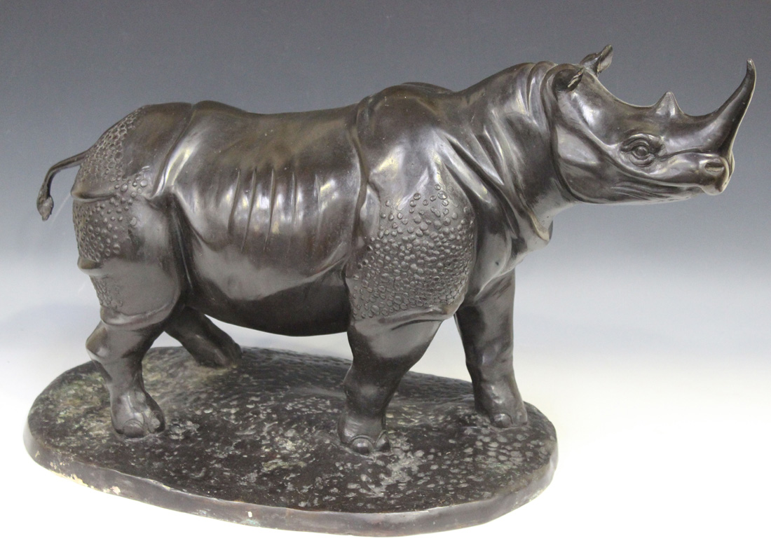 A 20th Century black patinated cast bronze figure of a rhinoceros, standing on an oval base, - Image 3 of 3