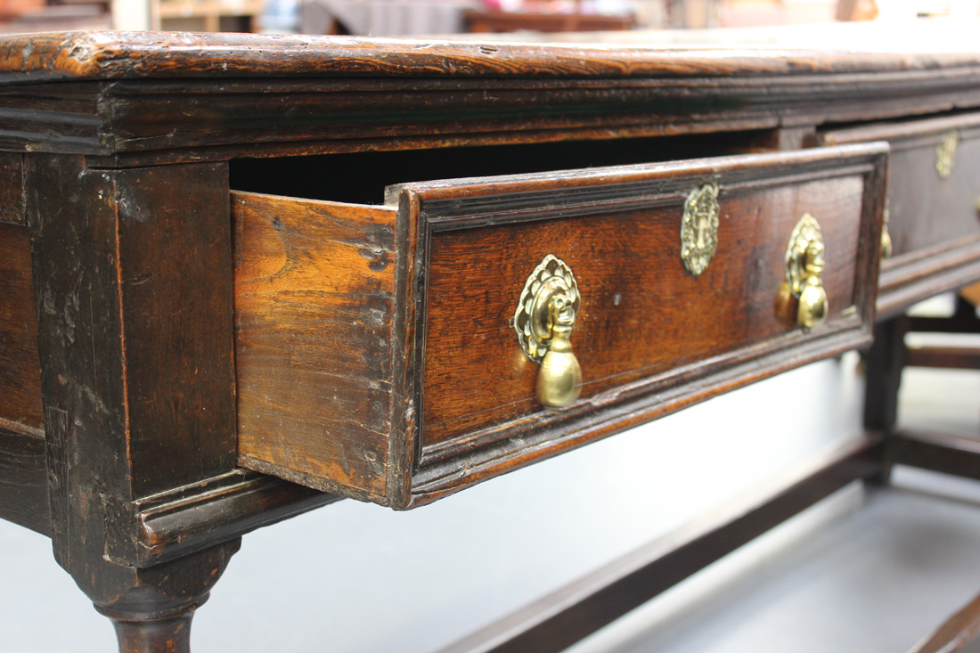 A late 17th/early 18th Century oak dresser base, the two-plank top above three frieze drawers with - Image 6 of 6