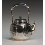 An early 20th Century Japanese silver kettle, the cover with jade ball finial, beneath an overhead