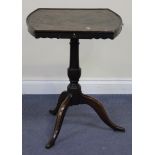 An 18th Century oak wine table, the shaped top fitted with three frieze drawers above a turned