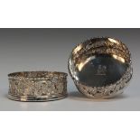 A pair of George III silver wine coasters, each with a beaded rim above pierced and engraved scallop
